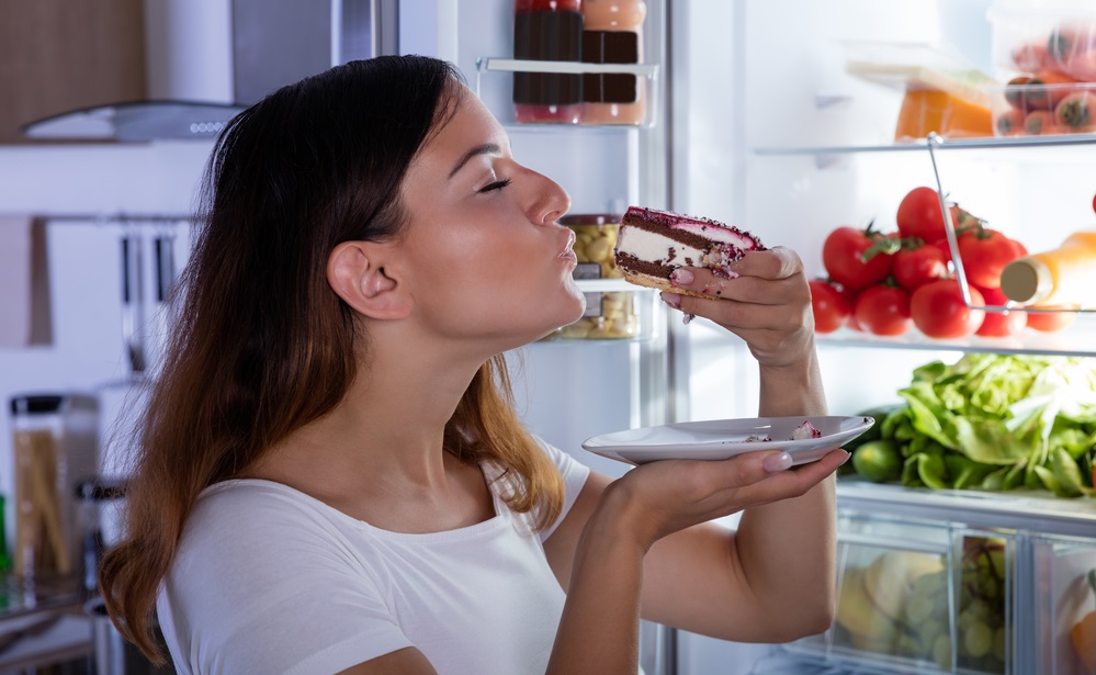 WOMAN EATING SWEET